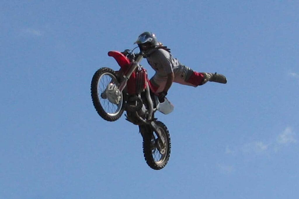 Motocross rider mid-air doing a trick