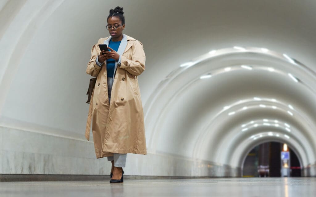 woman walking through underground tunnel