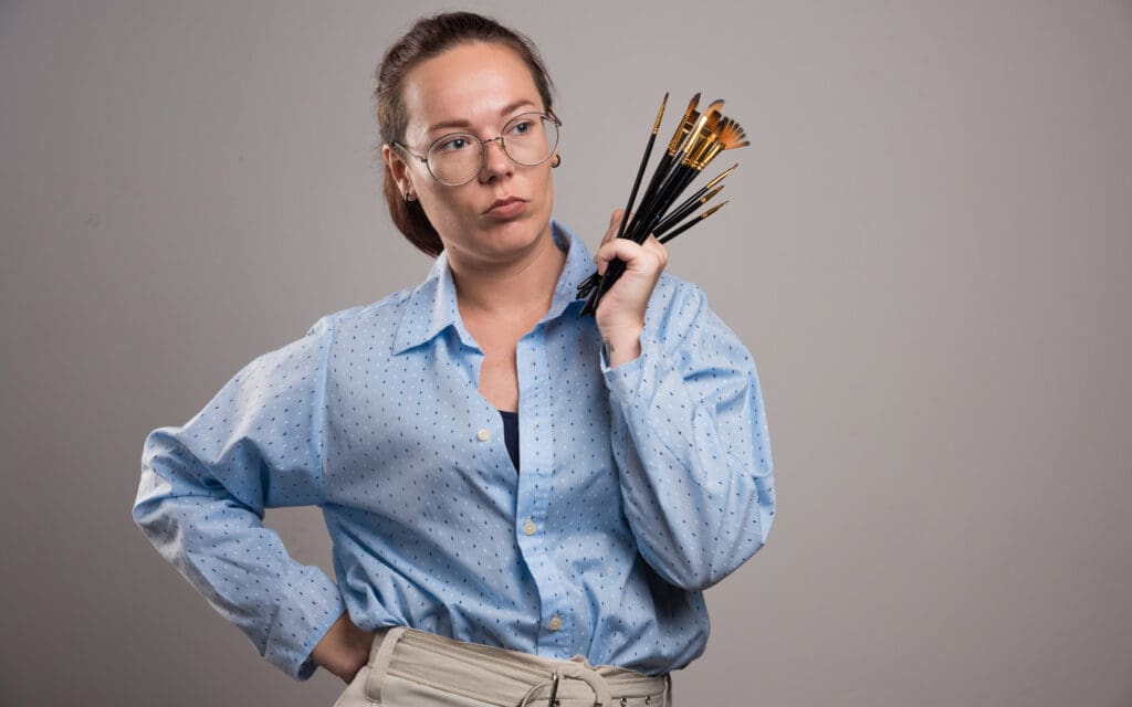 woman with paintbrushes