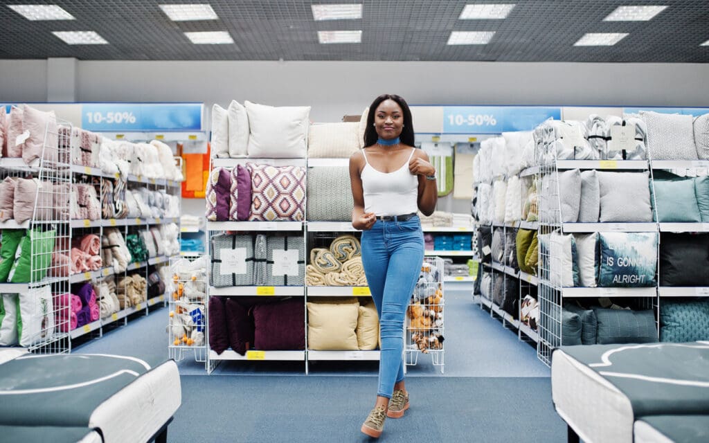 Woman standing in bedding department of store