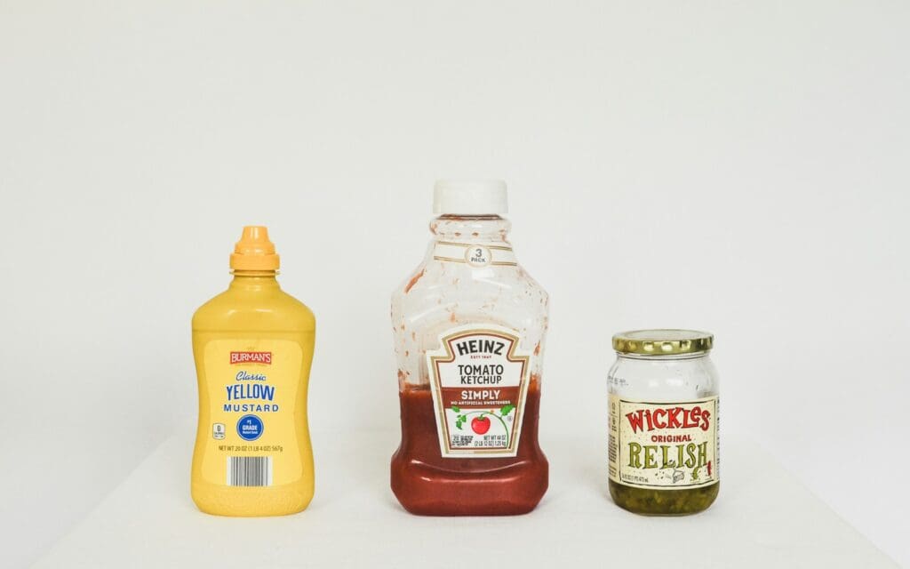 a group of bottles of condiments
