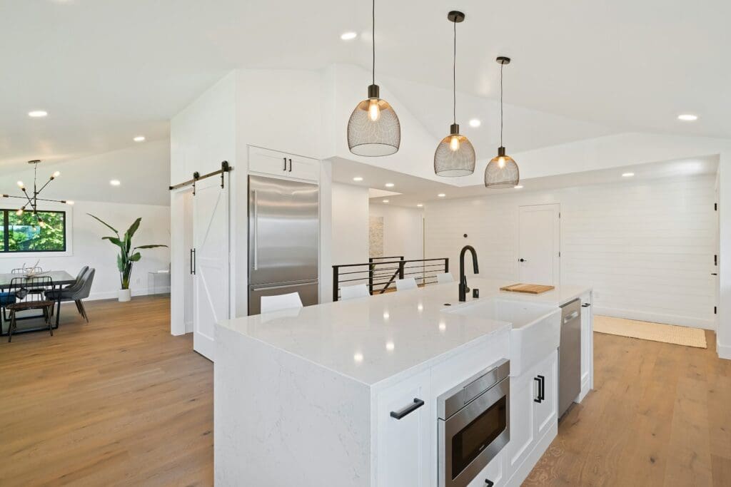 turned on pendant lamps above kitchen island