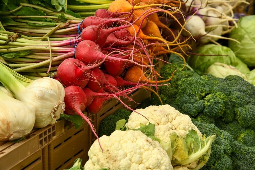 red and green vegetable on brown woven basket