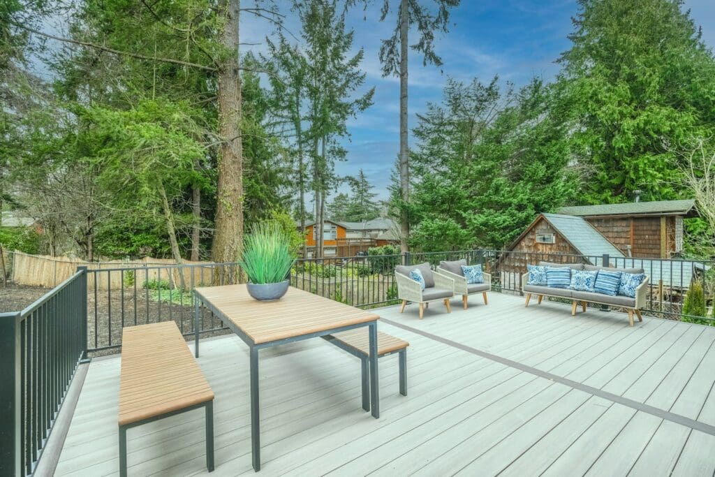 brown wooden table and chairs on wooden deck