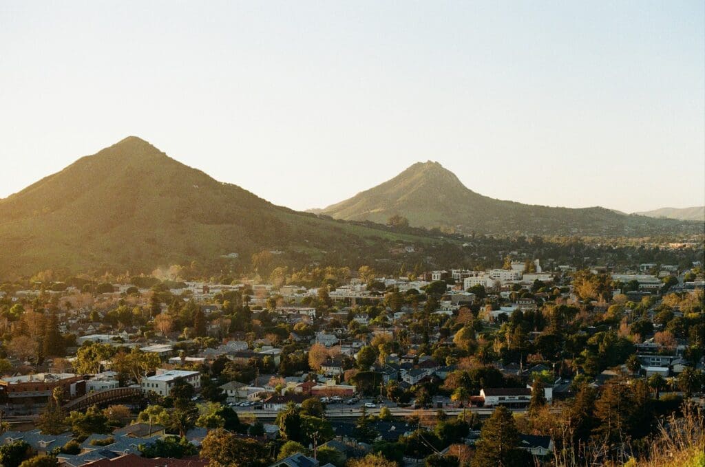 a view of a city with mountains in the background