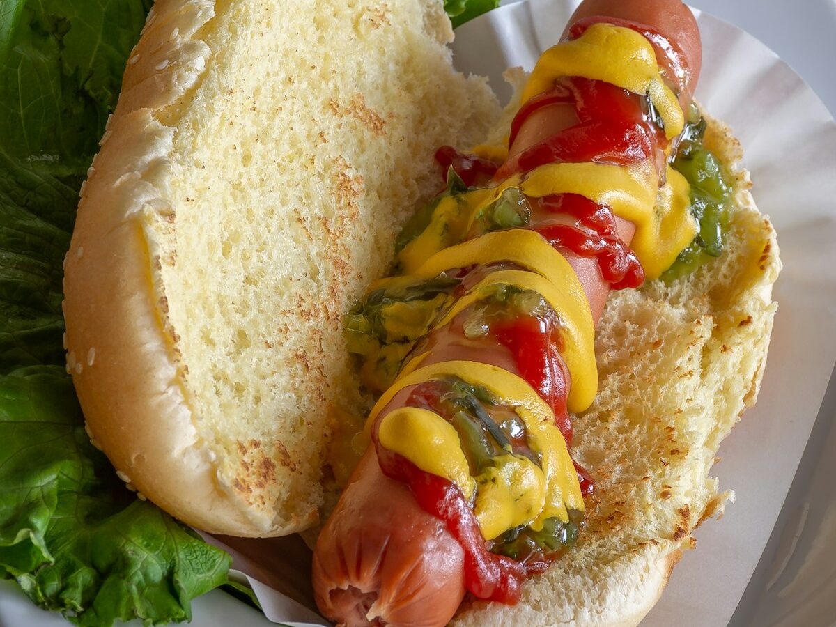hotdog sandwich with tomato and lettuce