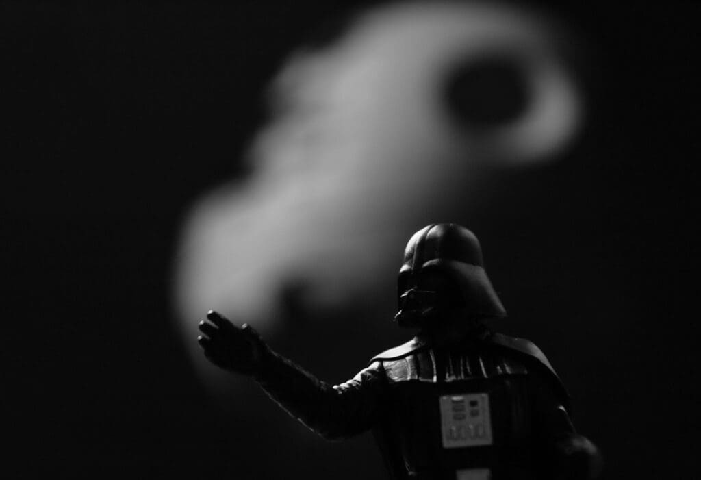 grayscale photo of Star Wars Darth Vader action figure
