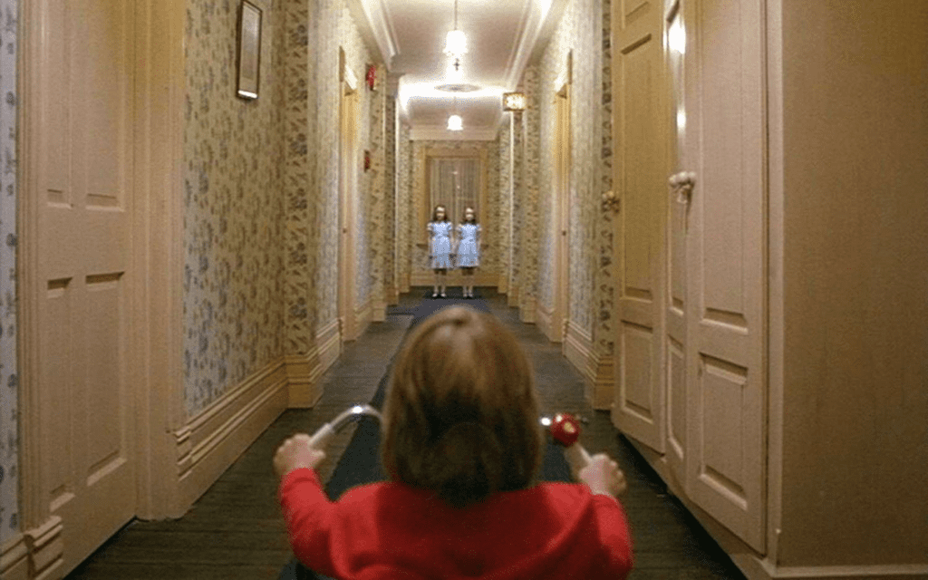 A still shot from The Shining in which Danny encounters two ghosts