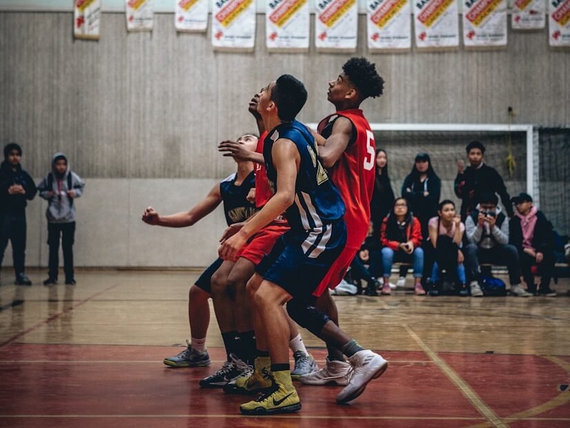 group of people playing basketball