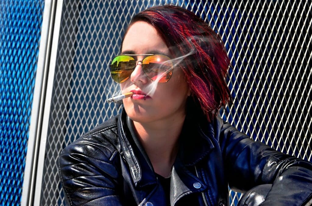 woman sitting while smoking