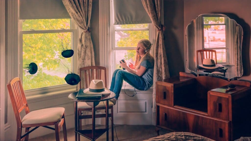 Girl Sitting Near a Window Wearing Headphone