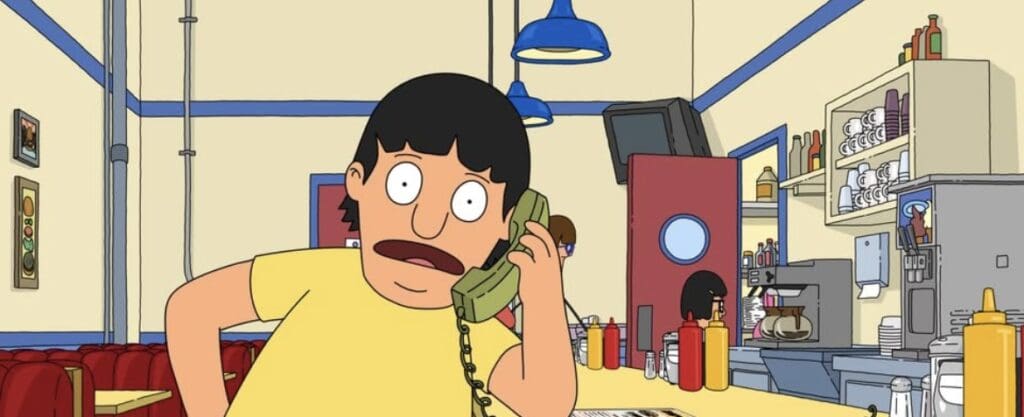 Gene talking into a phone