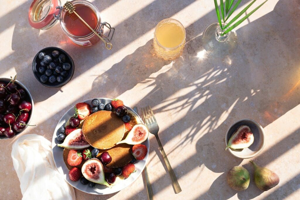 sliced fruits on white ceramic plate