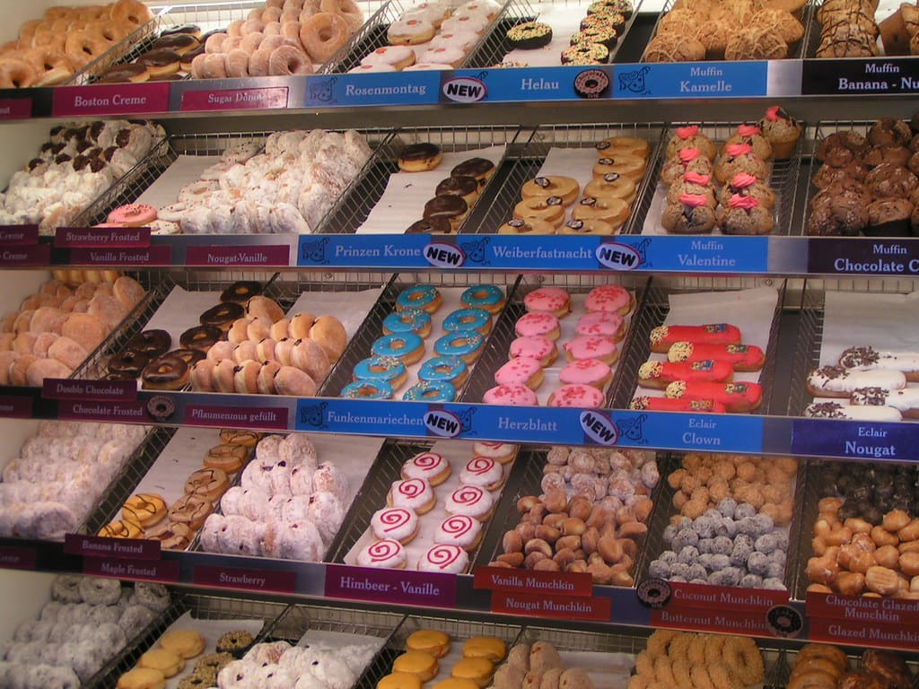 several shelves full of donuts