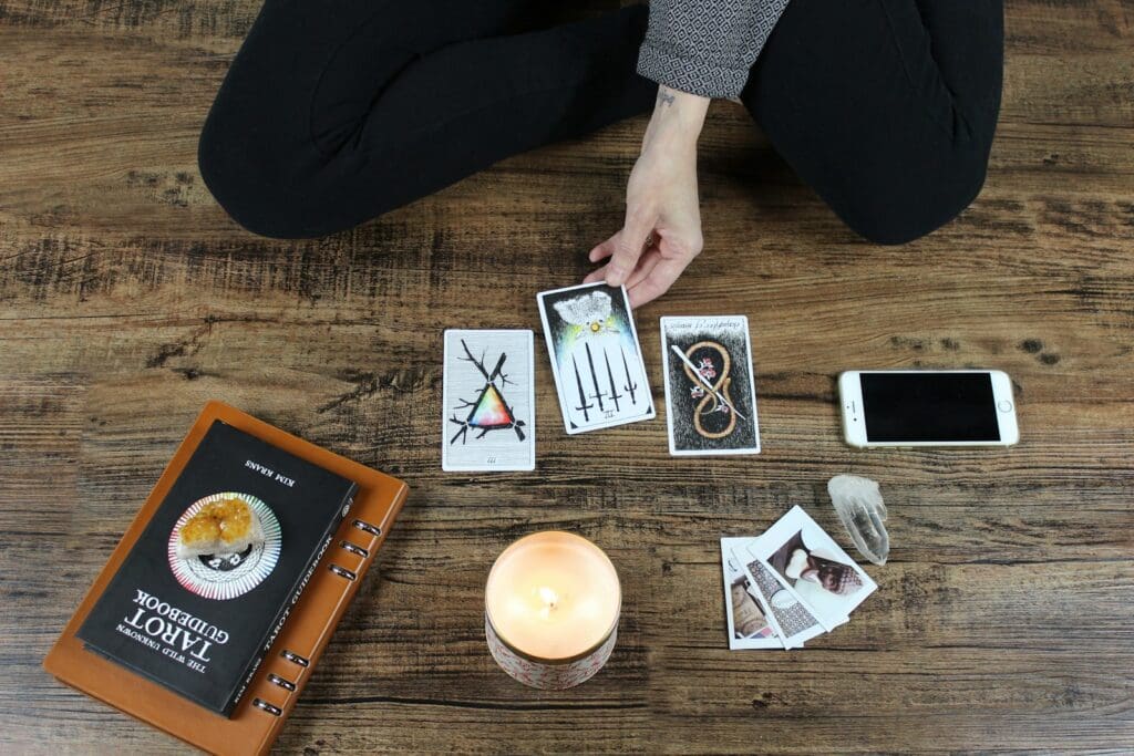 person playing with tarrot cards