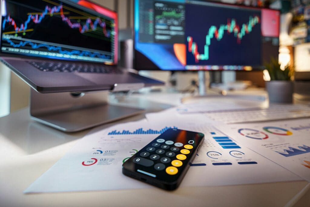 a remote control sitting on top of a table stock market concept