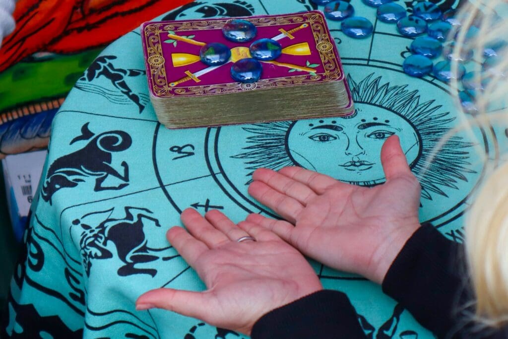 person holding brown wooden box