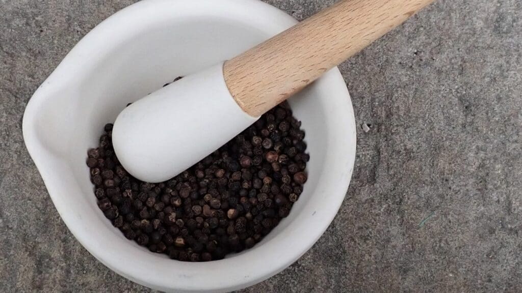 black pepper in a mortar and pestle