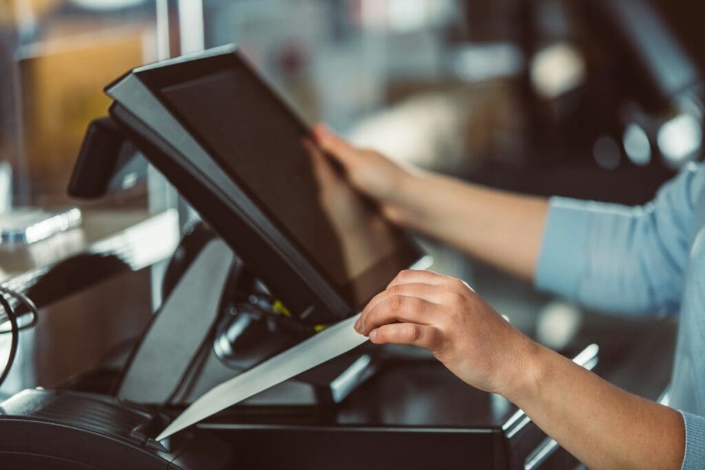 a person is using a tablet on a conveyor belt