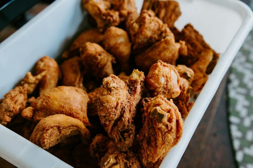 brown chicken in white container