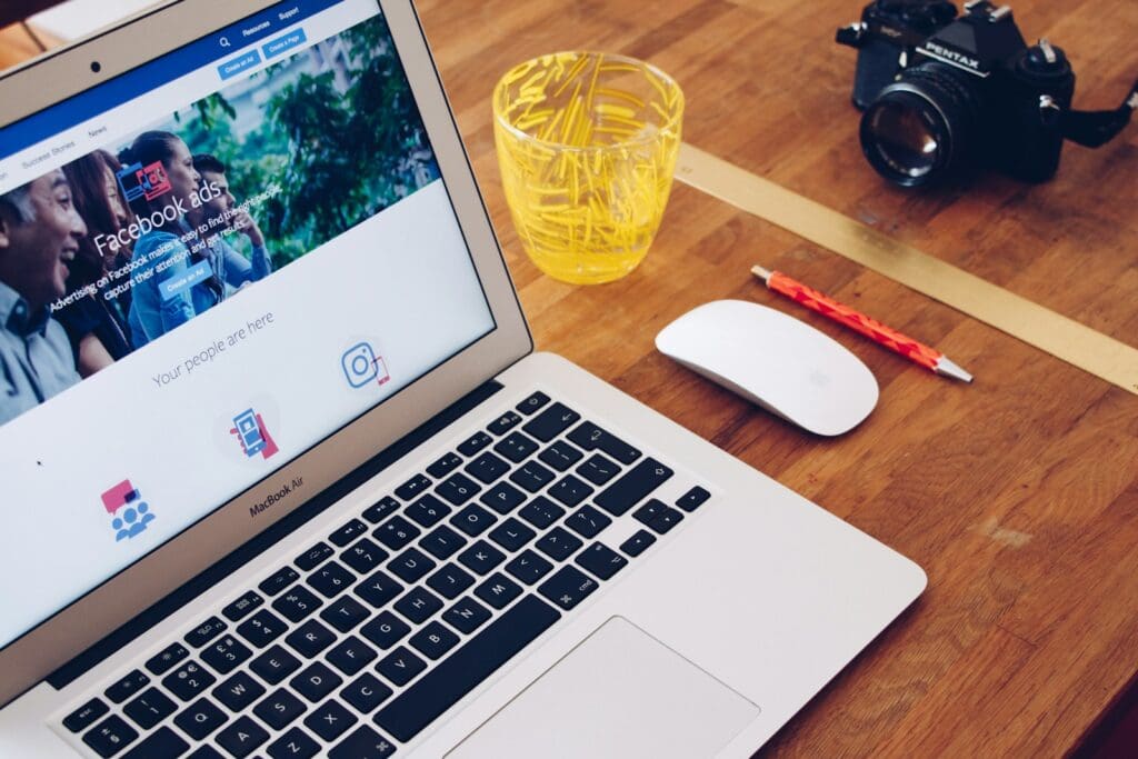 MacBook Air on table with Facebook visible