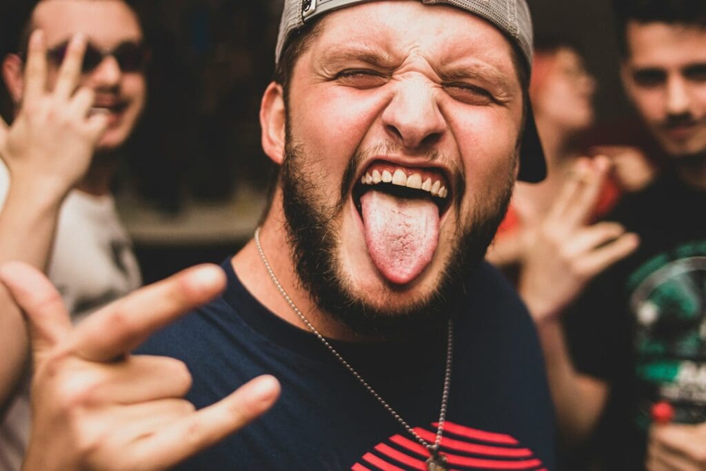 a man making a face with his tongue out