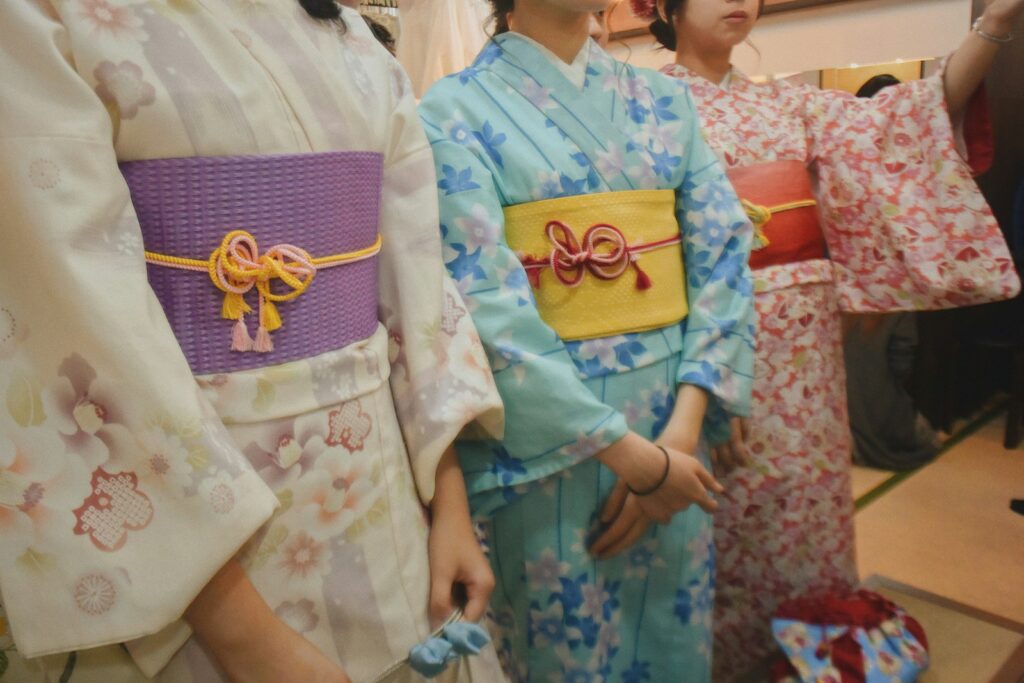 three women wearing kimonos