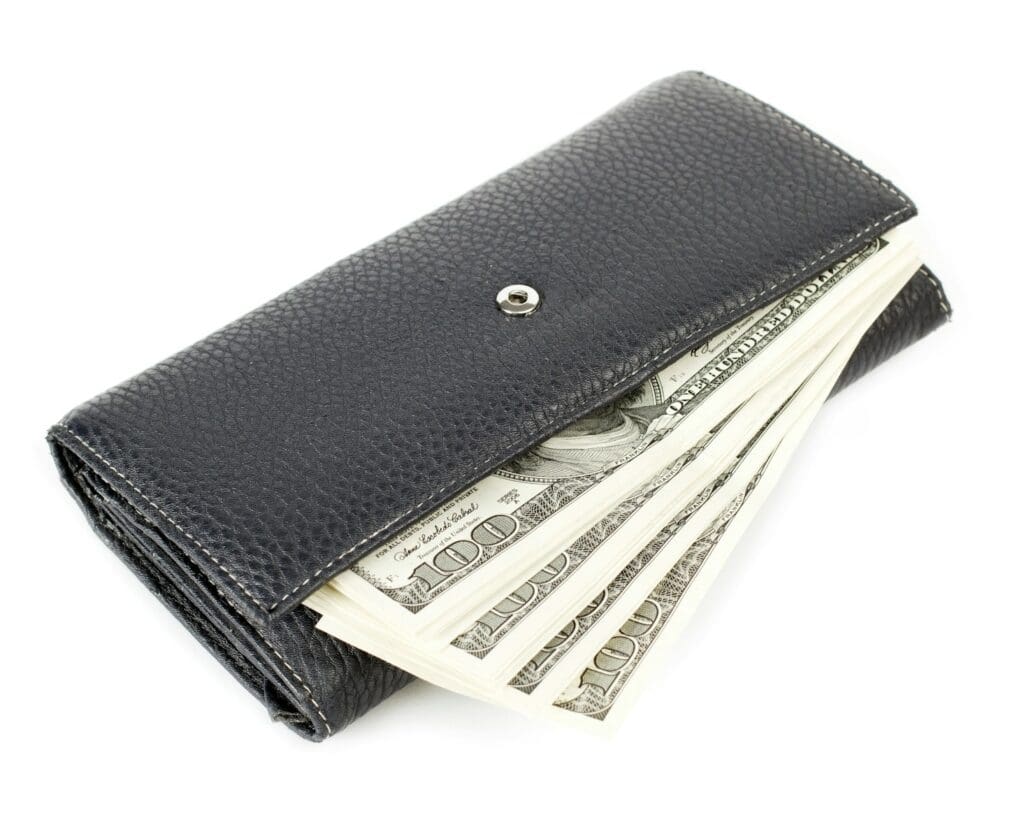 a wallet with money sticking out of it