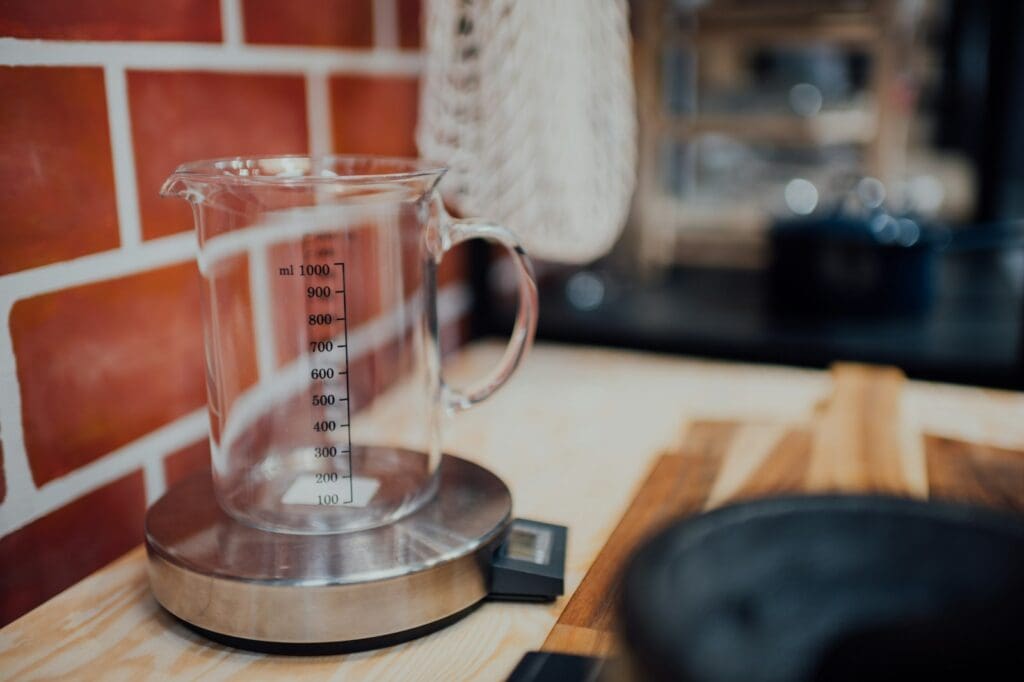 clear glass mug on brown wooden table