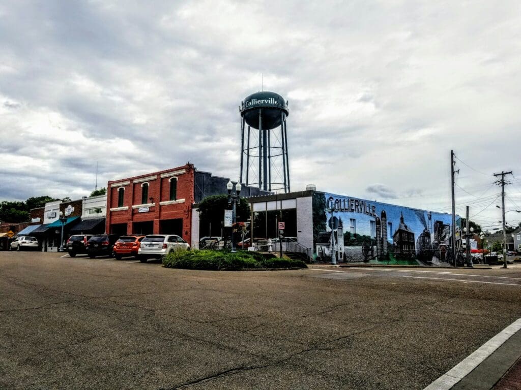 cars parked in front of red brick building