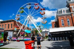 a large ferris wheel sitting in the middle of a street