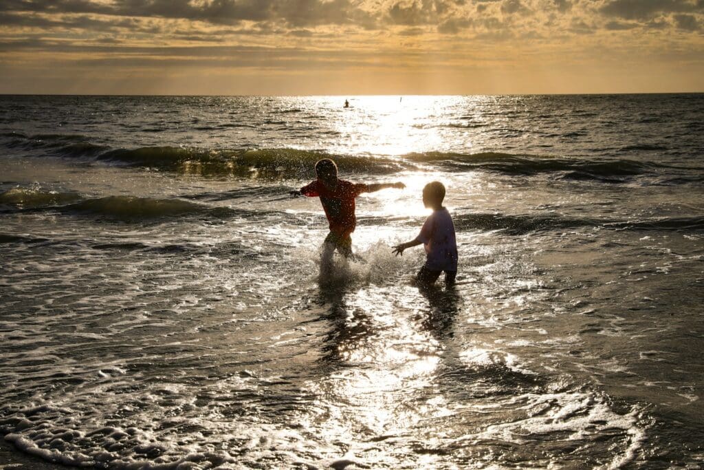 a couple of people that are in the water