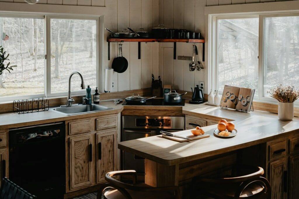 a kitchen with a sink, stove, and counter top