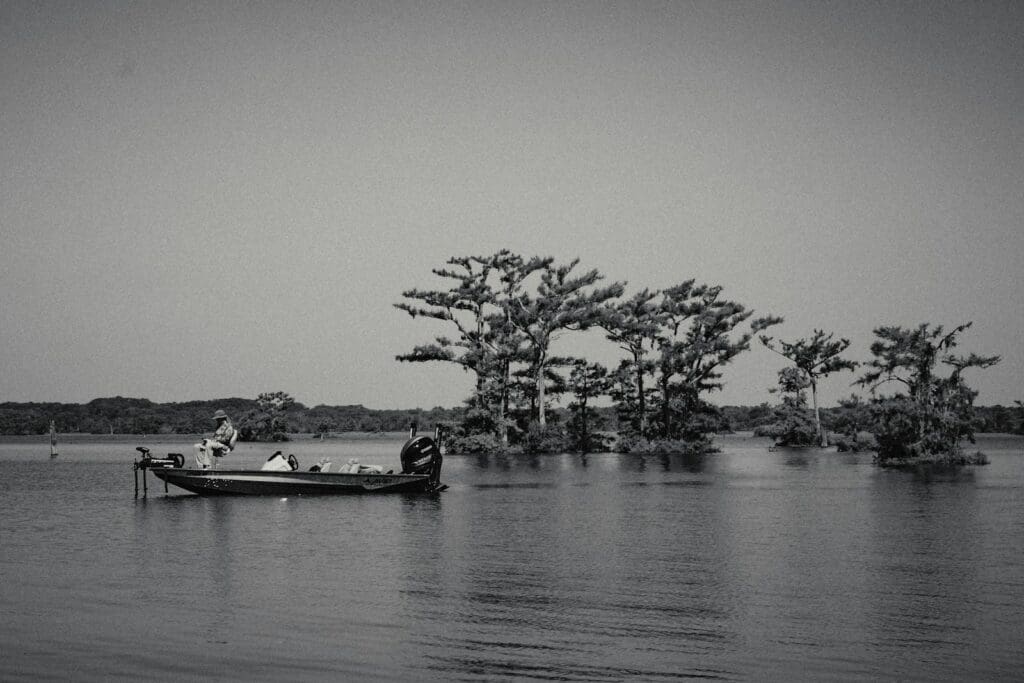 A boat floating on top of a large body of water