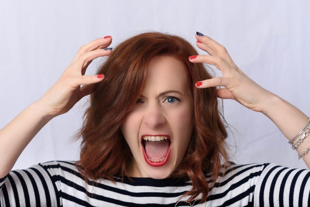 angry girl in black and white striped shirt