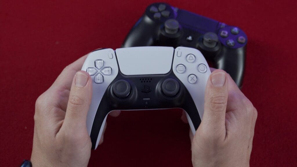 person holding black game controller