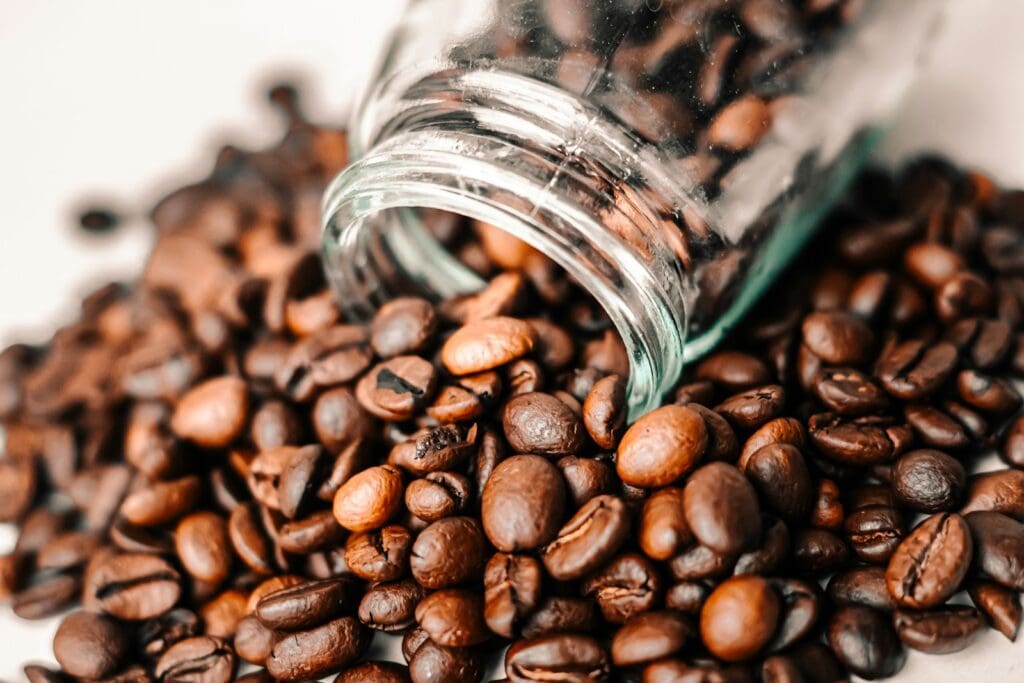 a pile of coffee beans sitting on top of a table