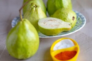 green fruit on white ceramic plate