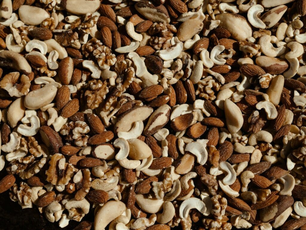 a mixture of nuts and nutshells on a table