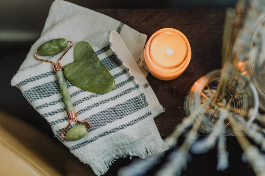 White and Green Textile Beside Orange Plastic Lid