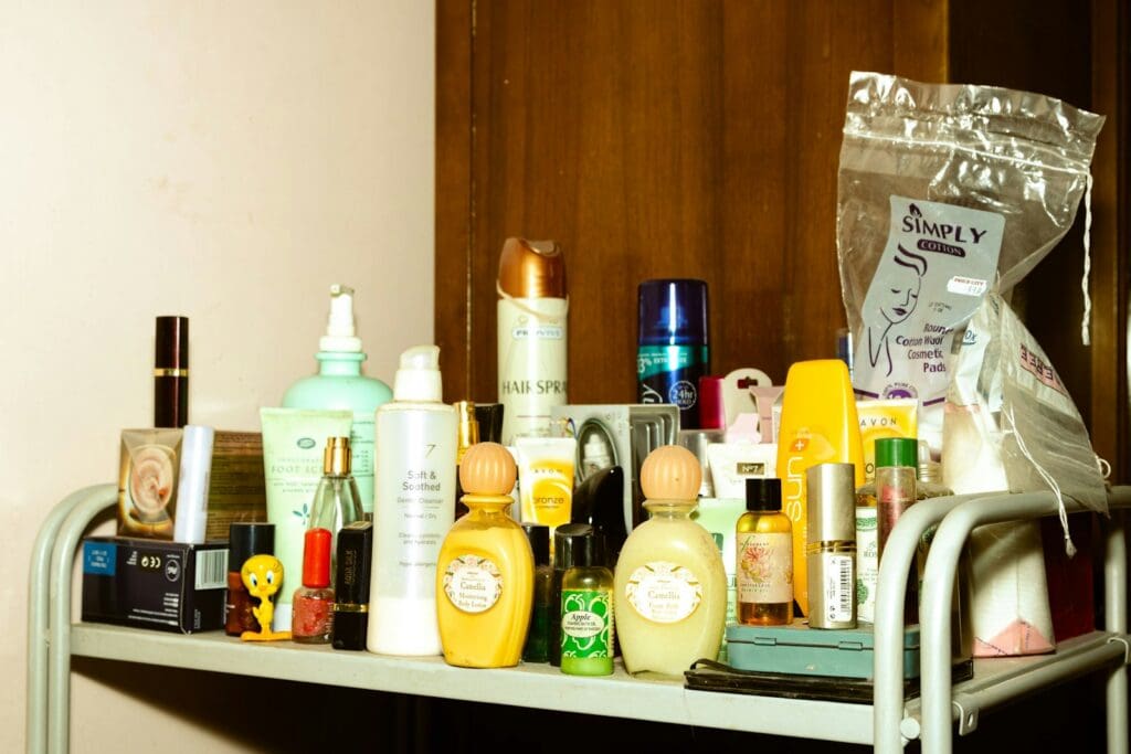 white and yellow plastic bottle on brown wooden shelf