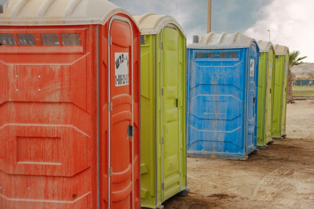 red and blue plastic trash bins