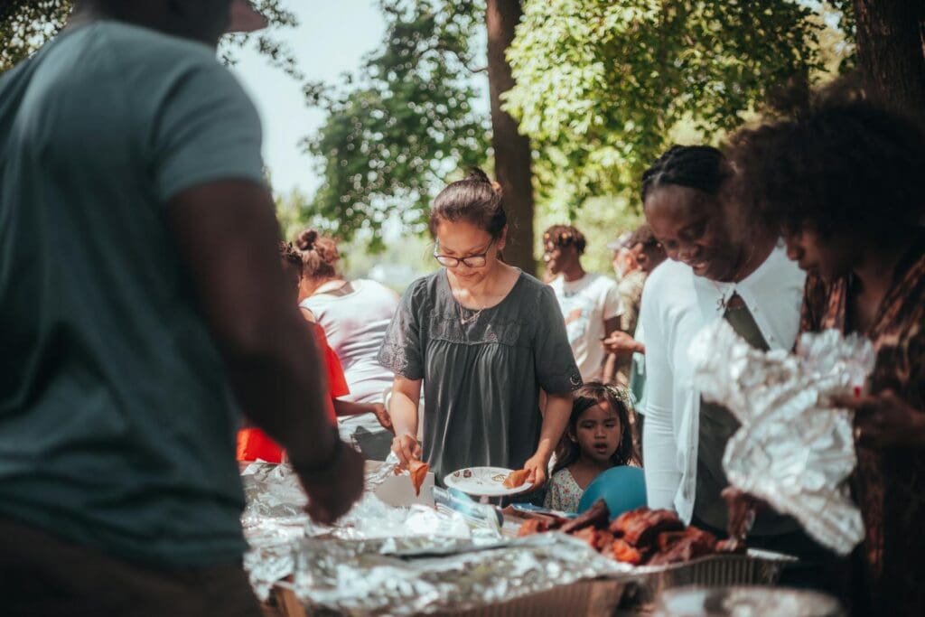 People Taking Food on Plate at Garden Party