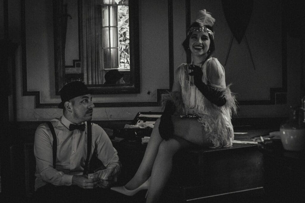 Smiling Woman in Flapper Dress Sitting with Man