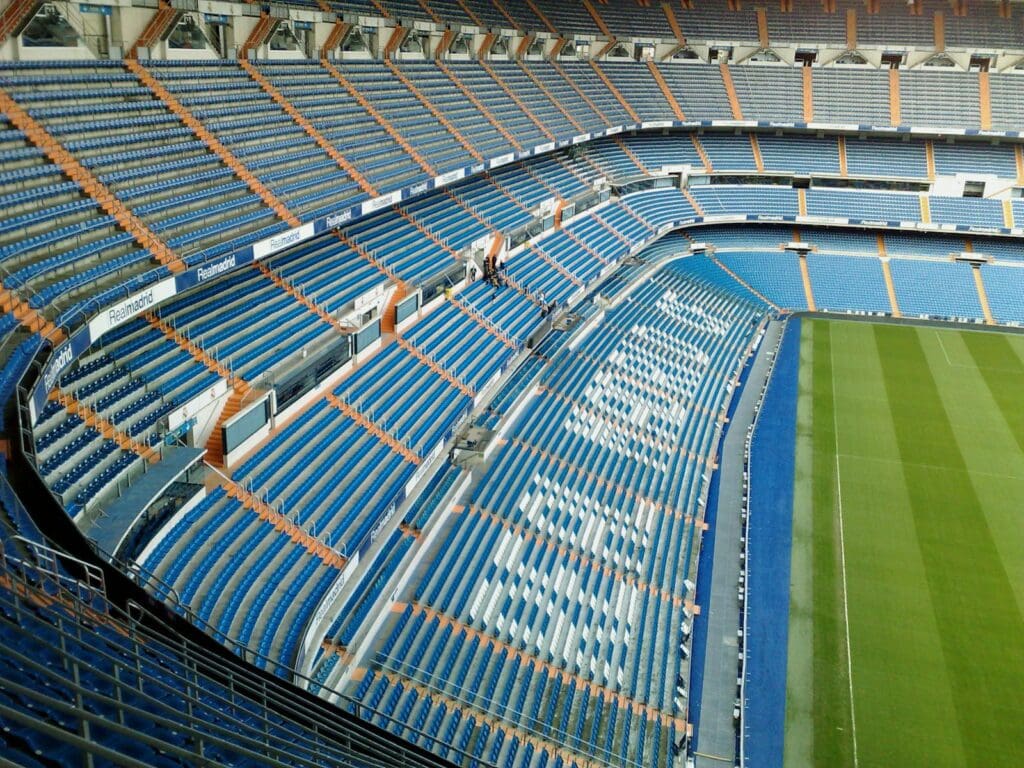 Aerial view of an empty stadium seating area in Madrid, showcasing a modern architectural design.