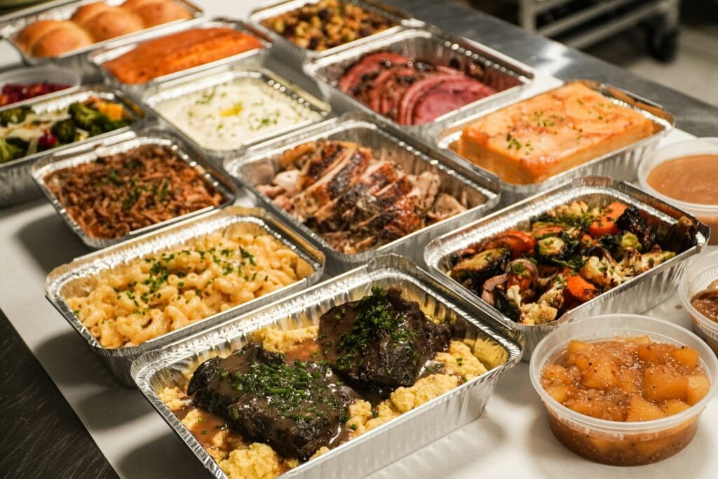 a buffet table filled with lots of different types of food