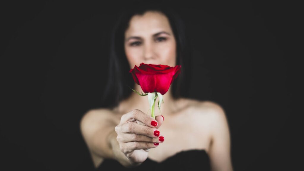 Woman Holding Red Rose