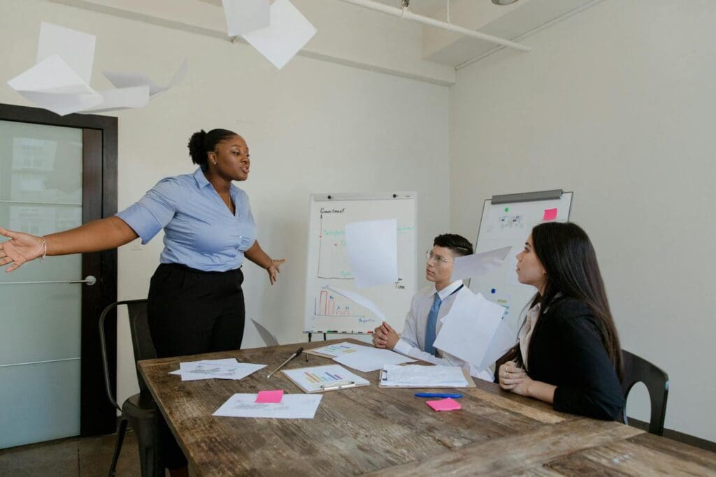 A group of professionals in a heated discussion during a business meeting.