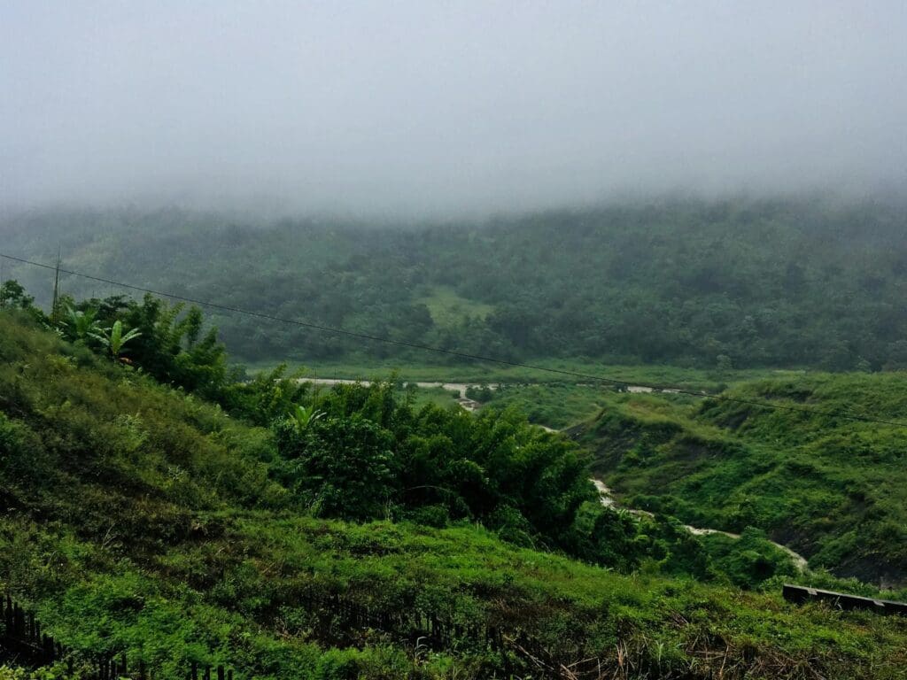 Aerial Photography of Mountain Under White Clouds Foggy Time