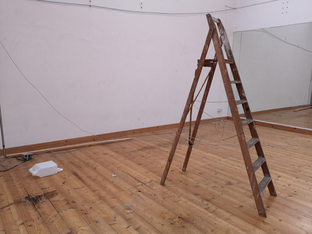 A wooden ladder in the house during construction